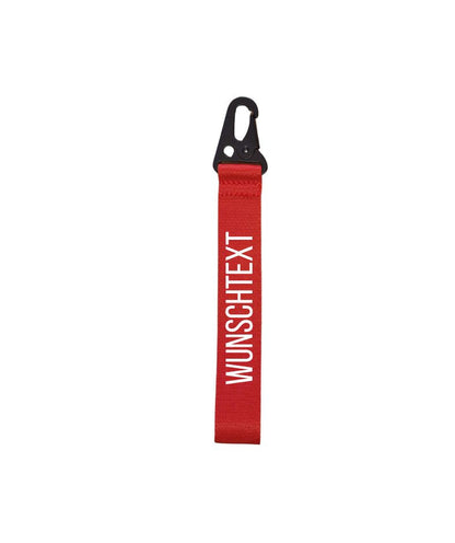 roter Schlüsselanhänger mit weißem Text: Wunschtext