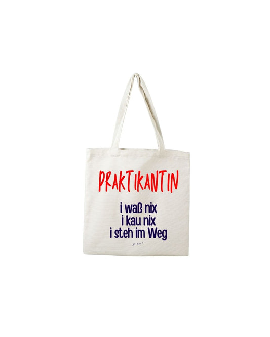 Baumwolltasche in natur mit rotem "Praktikantin" und dunkelblauem Textaufdruck in österreichischem Dialekt: "I waß nix, i kau nix, i steh im Weg" - Praktikantin Humor Einkaufstasche